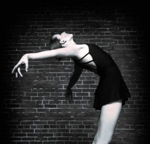 13098026 - black and white ballerina on grunge brick background